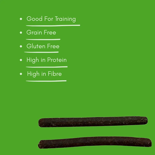 Two rabbit meaty sticks dog treats on green background with benefits like grain free, high protein.