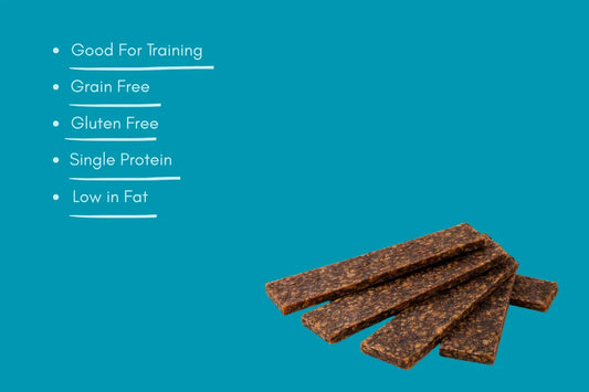 Natural duck strips dog treats, grain free, gluten free, high protein, low fat on blue background