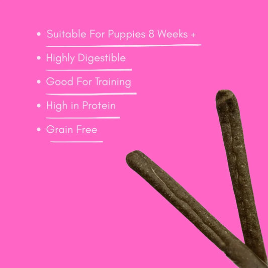 Venison dog sausage treats for puppies, high protein, grain free, on pink background