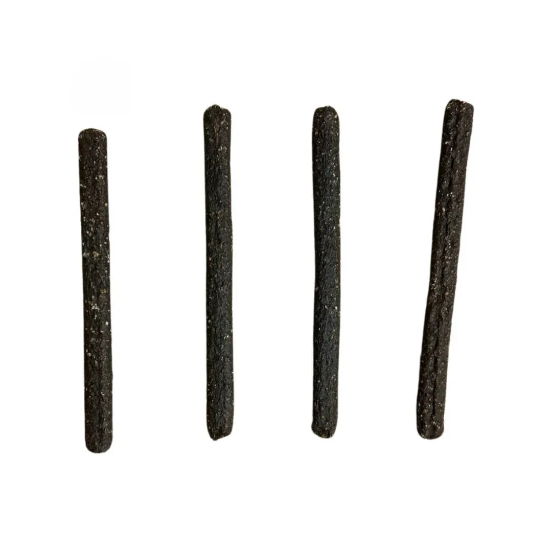 Four chicken meaty dog and cat treats sticks on a white background, natural pet snacks