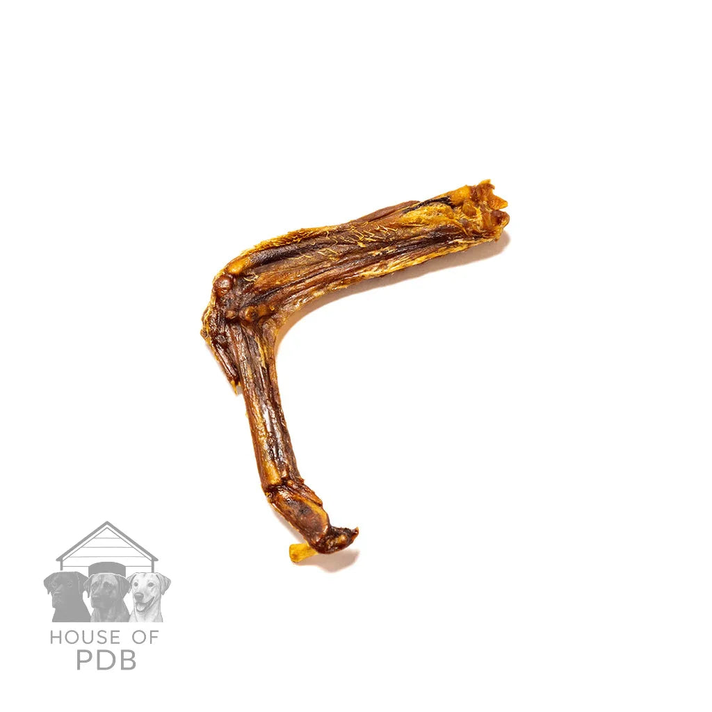 Dried duck wing dog chew treat on white background with House of PDB watermark