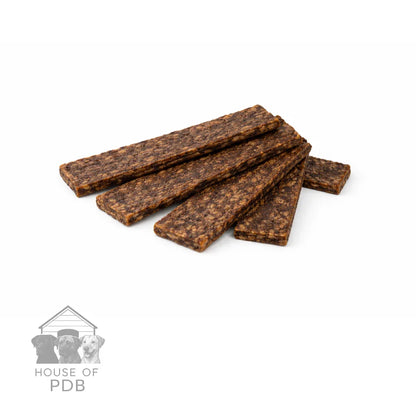 Dog treats stacked on a white background with 'House of PDB' logo.