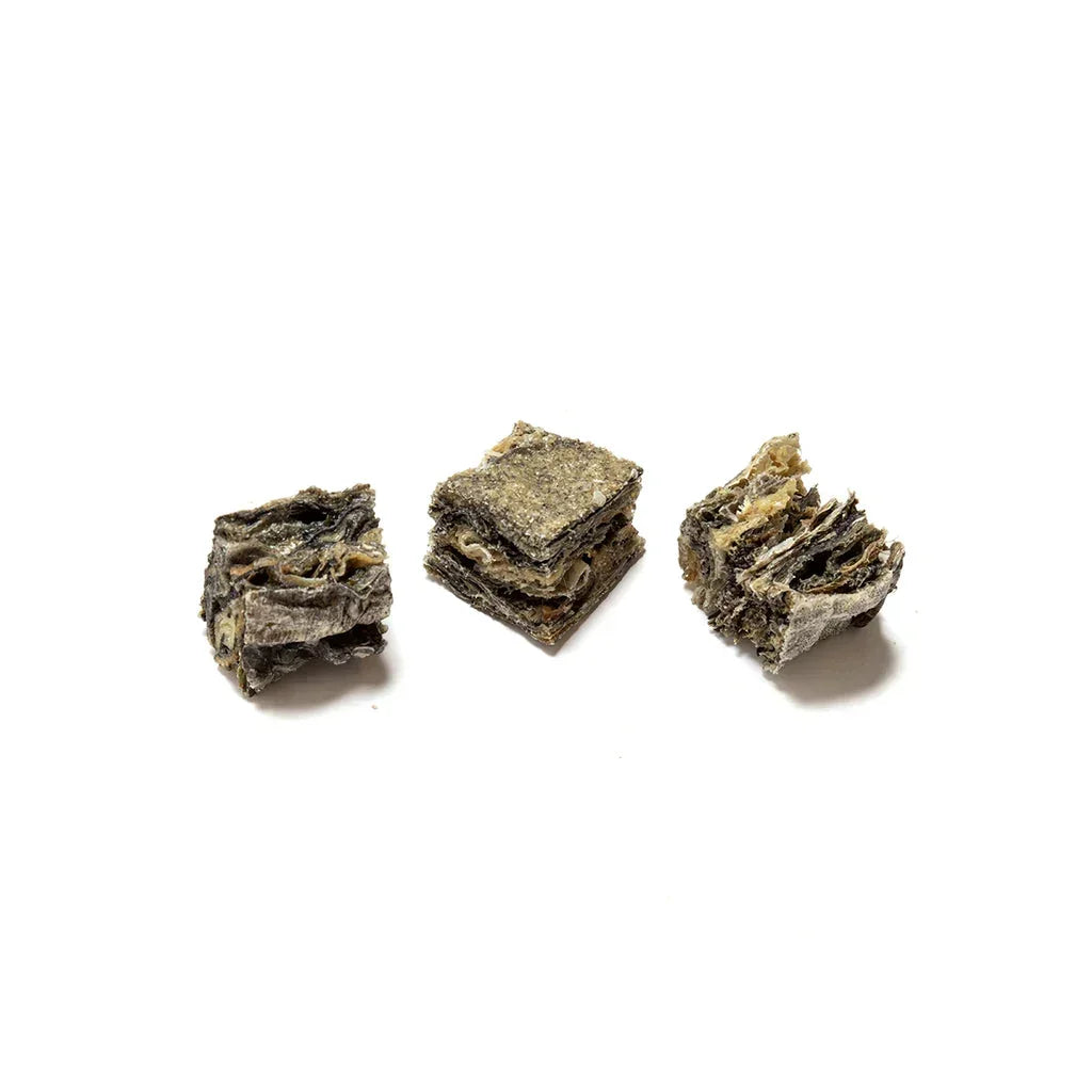 Three natural fish skin cubes dog treats on a white background, House Of PDB product