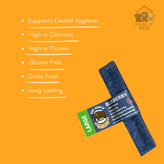 Large blueberry yak Dog chew treat with label on an orange background, featuring text about benefits.