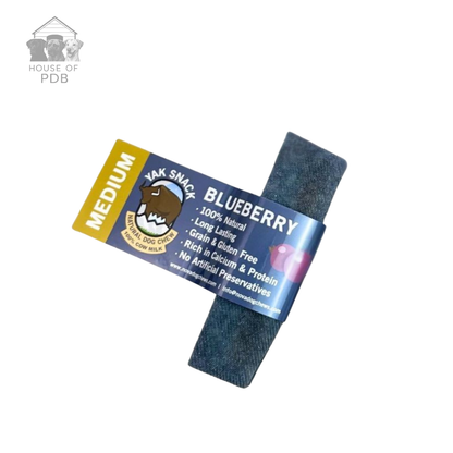 Medium blueberry yak dog chew with label on a white background