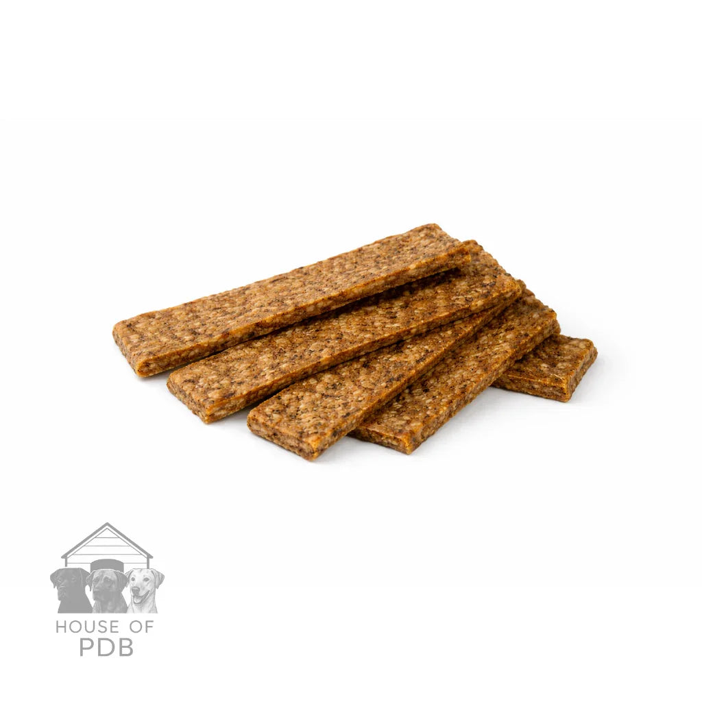 Dog treats stacked on a white background with 'House of PDB' logo.