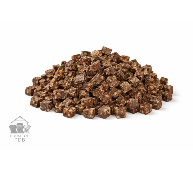 Pile of brown pet food cubes on a white background