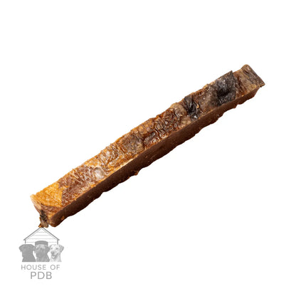 Single dried salmon skin strip isolated on white background, pet treat