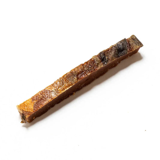 Natural salmon skin strip dog treat on white background, House Of PDB pet snack