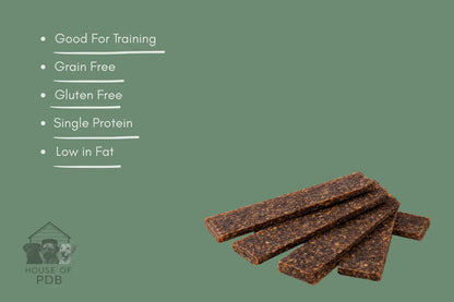 Dog treat bars with health benefits listed on a green background, featuring the House of PDB logo.