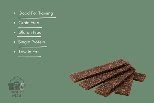 Dog treat bars with health benefits listed on a green background, featuring the House of PDB logo.